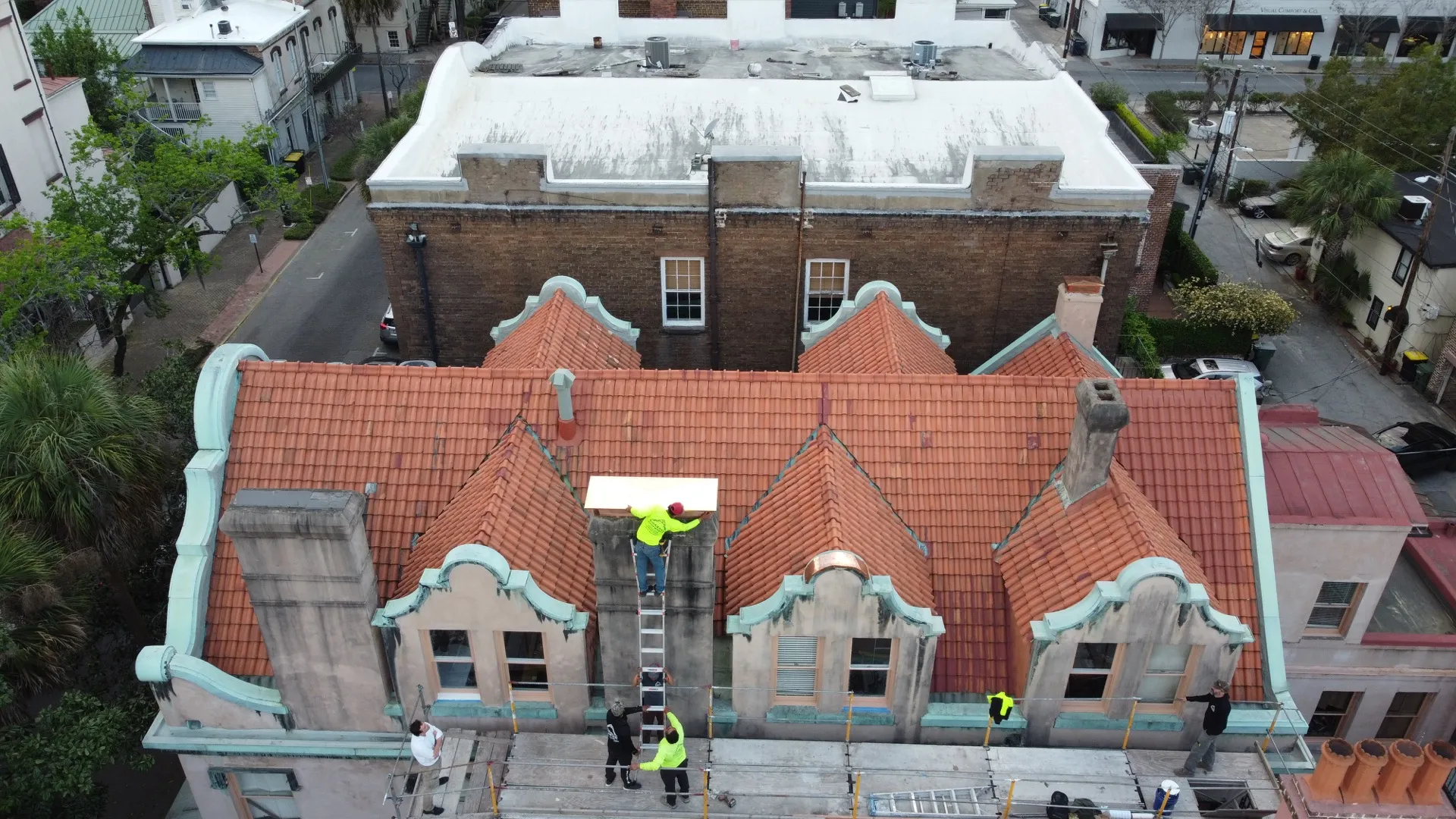 A Coastal Roofworks crew at work on a Savannah roof