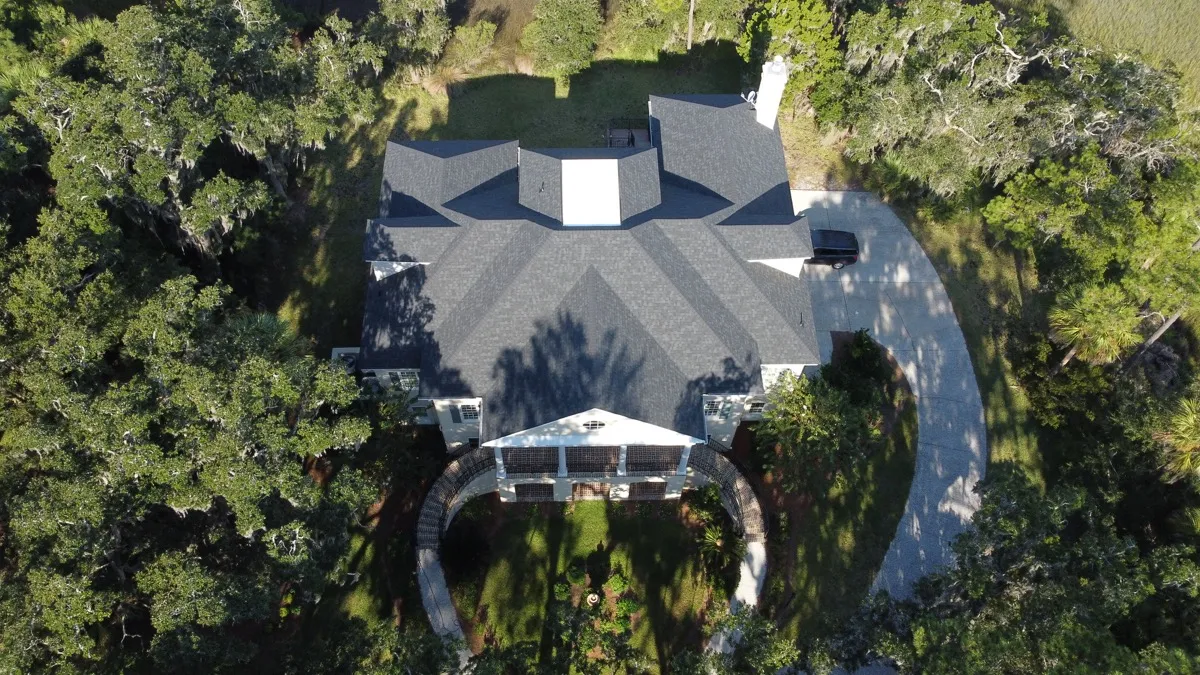 Estate roof among live oaks