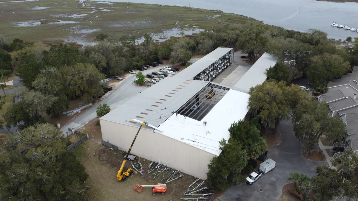 Metal roof and crane on site